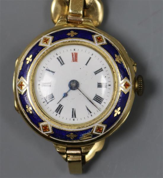 A ladys 18ct. gold and enamel wristwatch with 18ct expandable bracelet.
